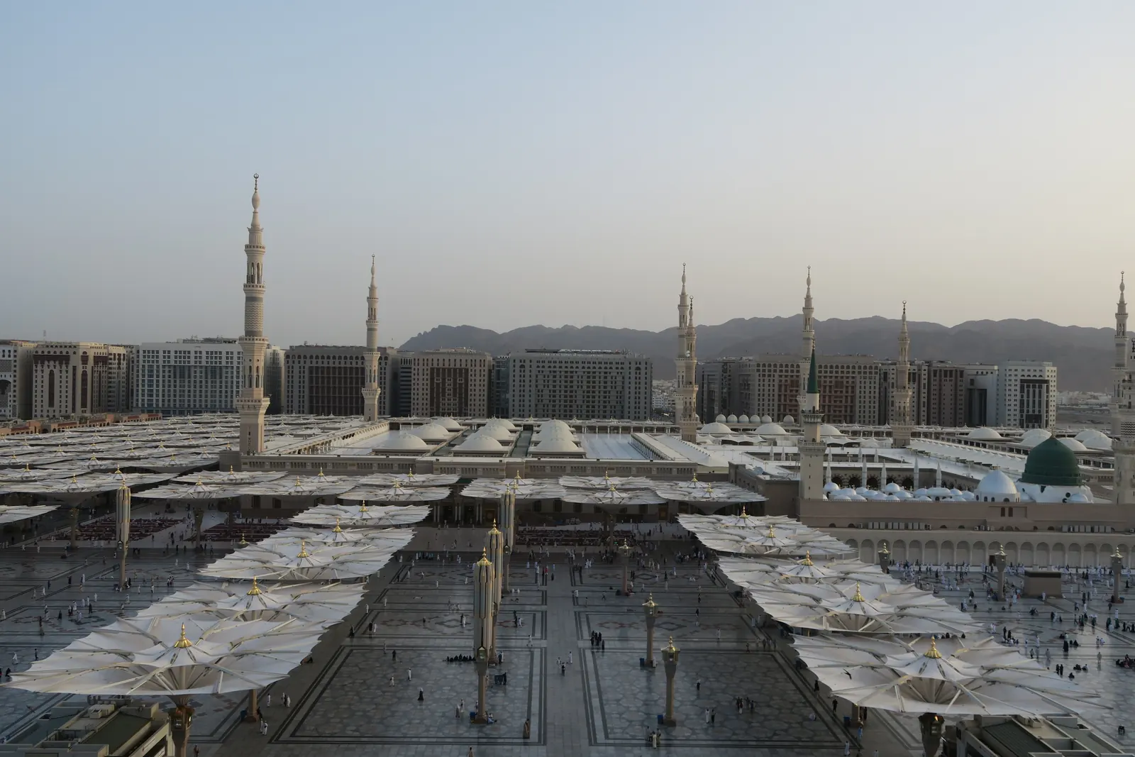 The courtyard of Masjid an-Nabawi in Madinah beneath its shade canopies