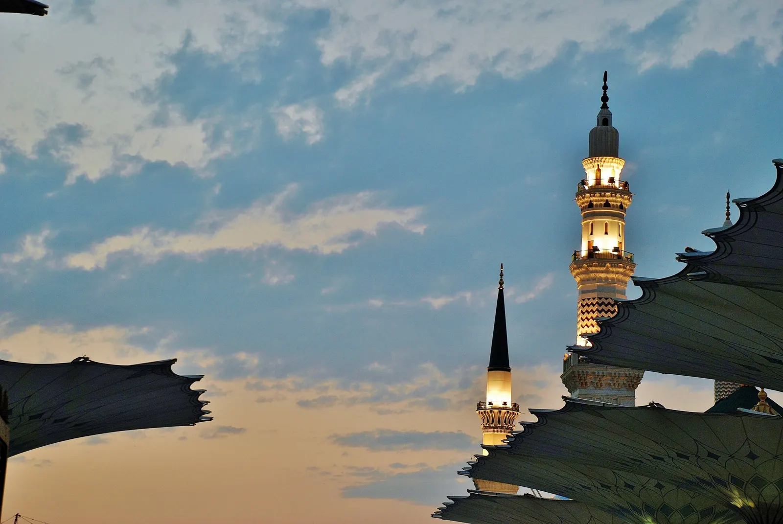 A minaret of the Grand Mosque at Makkah against the evening sky
