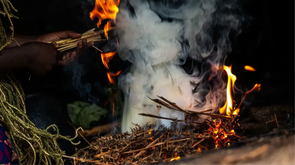 A traditional fire-making demonstration on the Batwa cultural trail